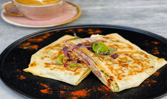 Breakfast wrap/ juice / hash brown.