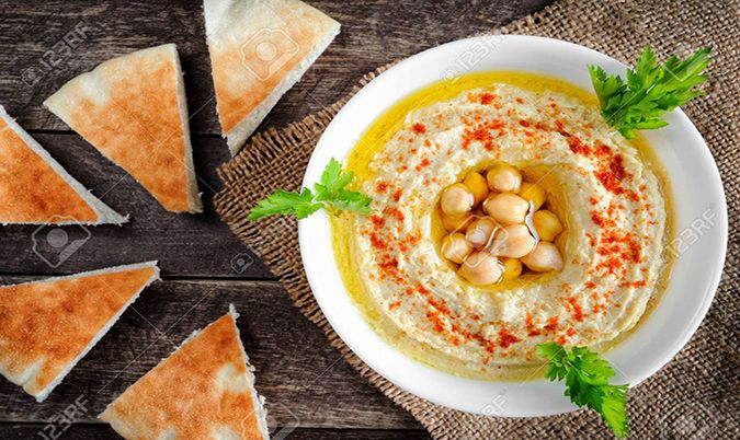 Hummus Dish With Bread And Olives
