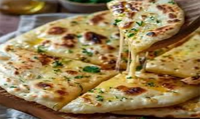 Cheese NaanPlain flour bread stuffed with mozzarella cheese, kasuri methi, coriander leaves and spices.